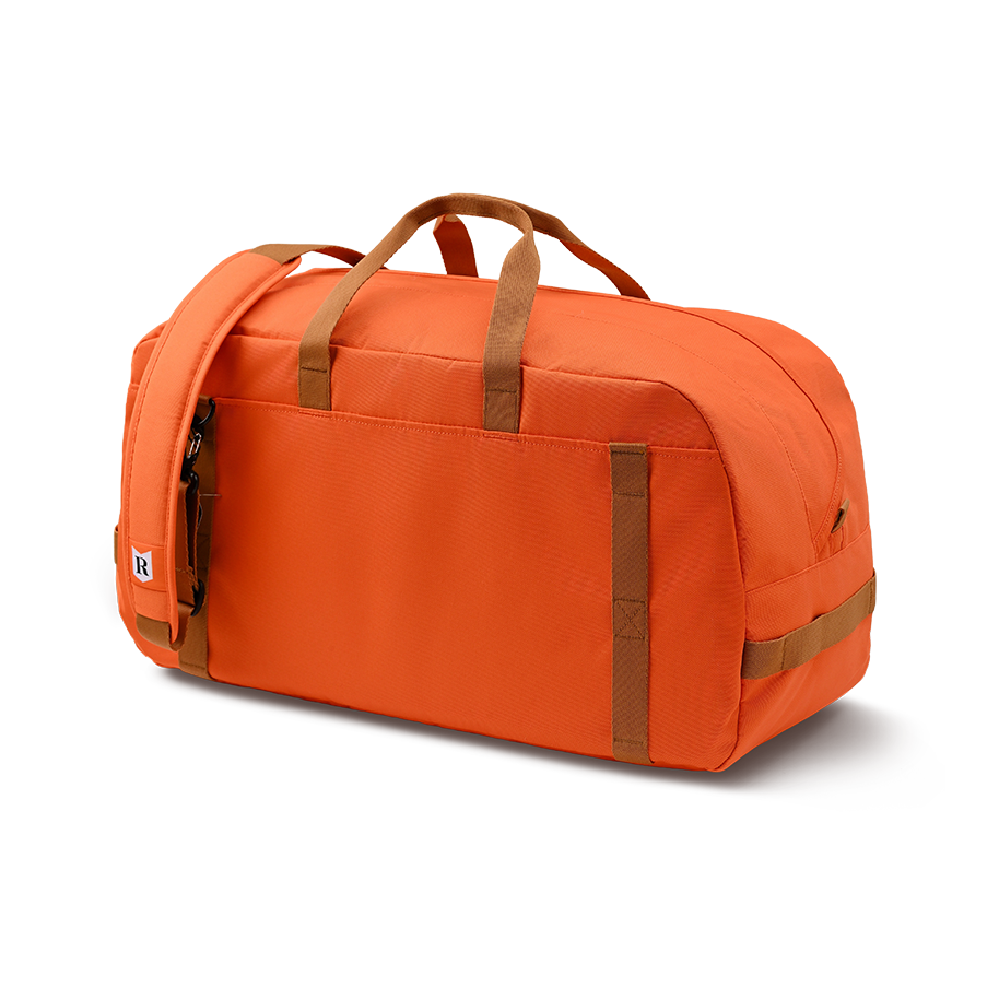 Ritual Calibre hockey duffle bag orange with brown straps, back view