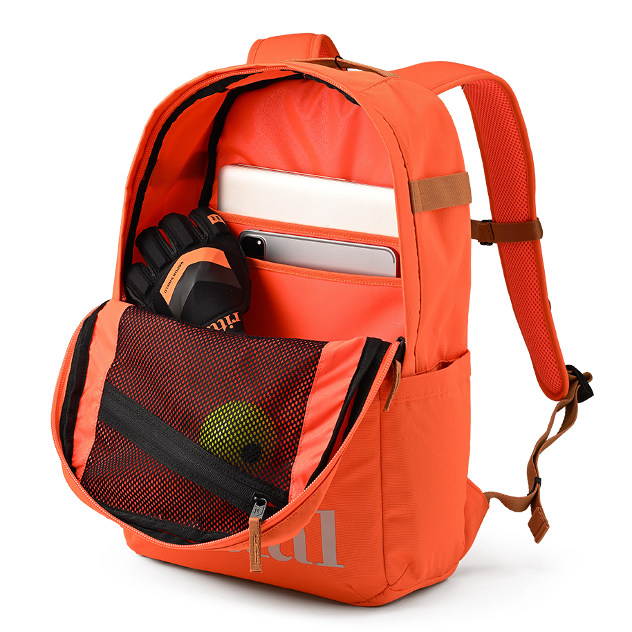 Ritual Covert hockey backpack orange with compartments and items, inside view