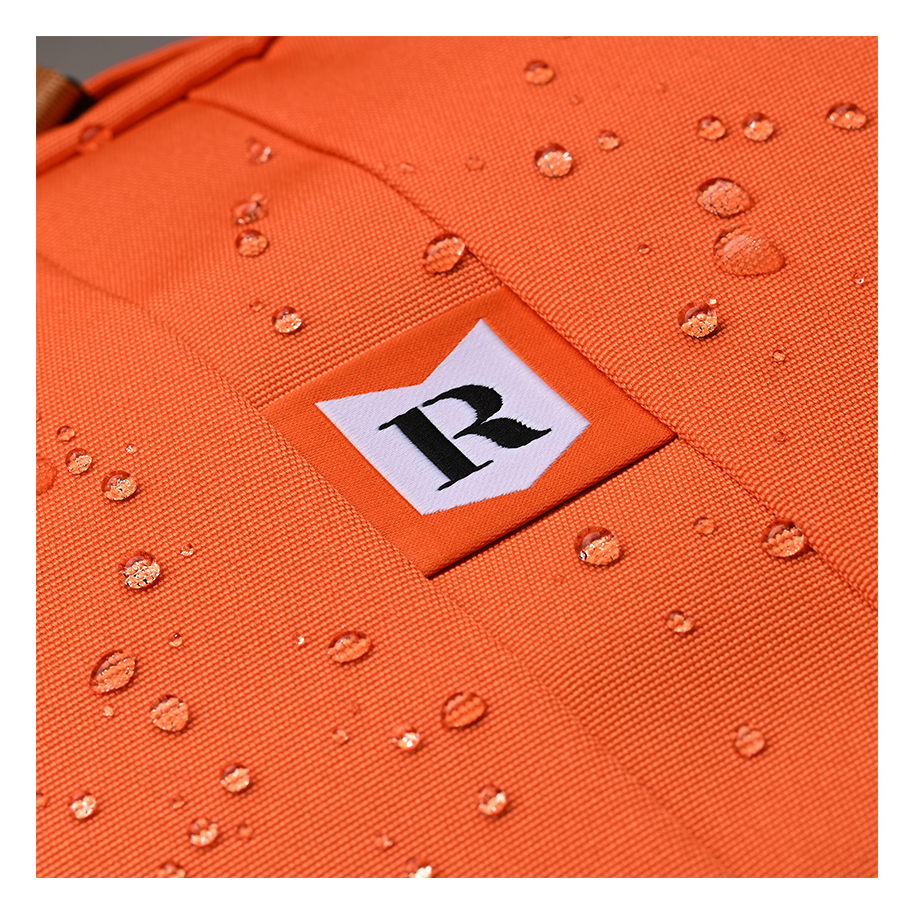 Ritual Covert hockey backpack orange water droplets and a logo 