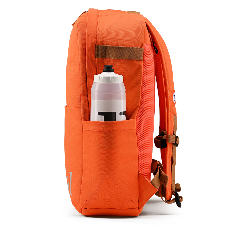 Ritual Covert hockey backpack orange with a water bottle in a pocket 