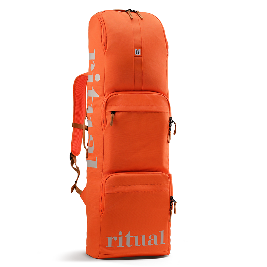 Ritual Hockey orange combo stick bag with silver logo, front and left-side view