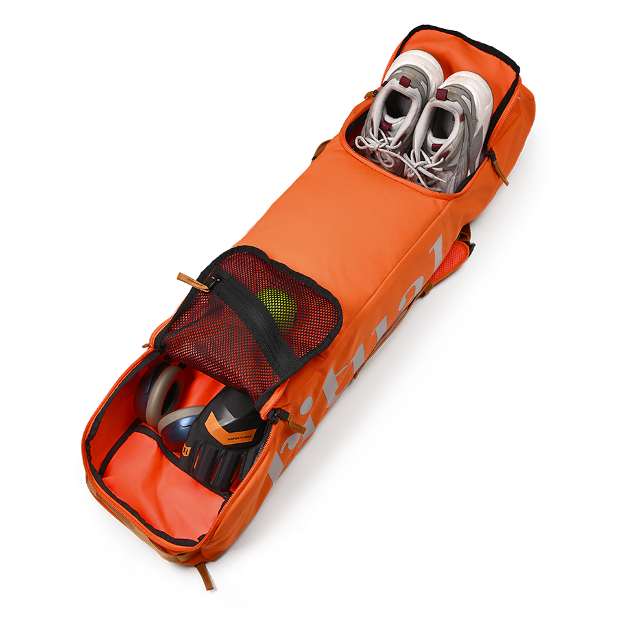 Ritual Hockey orange tactic stick bag with shoes and other items, inside view horizontal